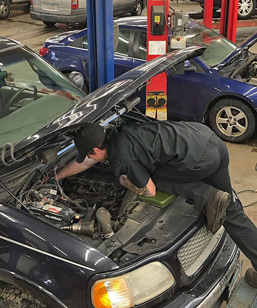 Technician working on an engine