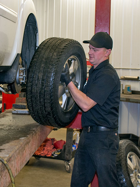 Technician handling a tire